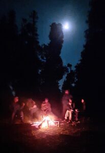 Camp fire under the moon-lit night at Hargaon Base Camp