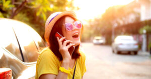 A woman laughing on the phone 