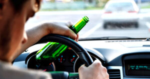 Man drinking while driving